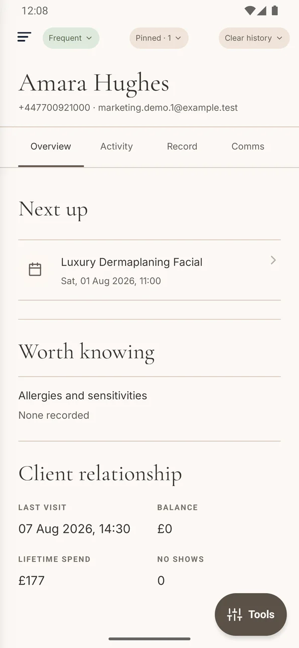 Elysium Bookings mobile client profile showing appointment history and client details.